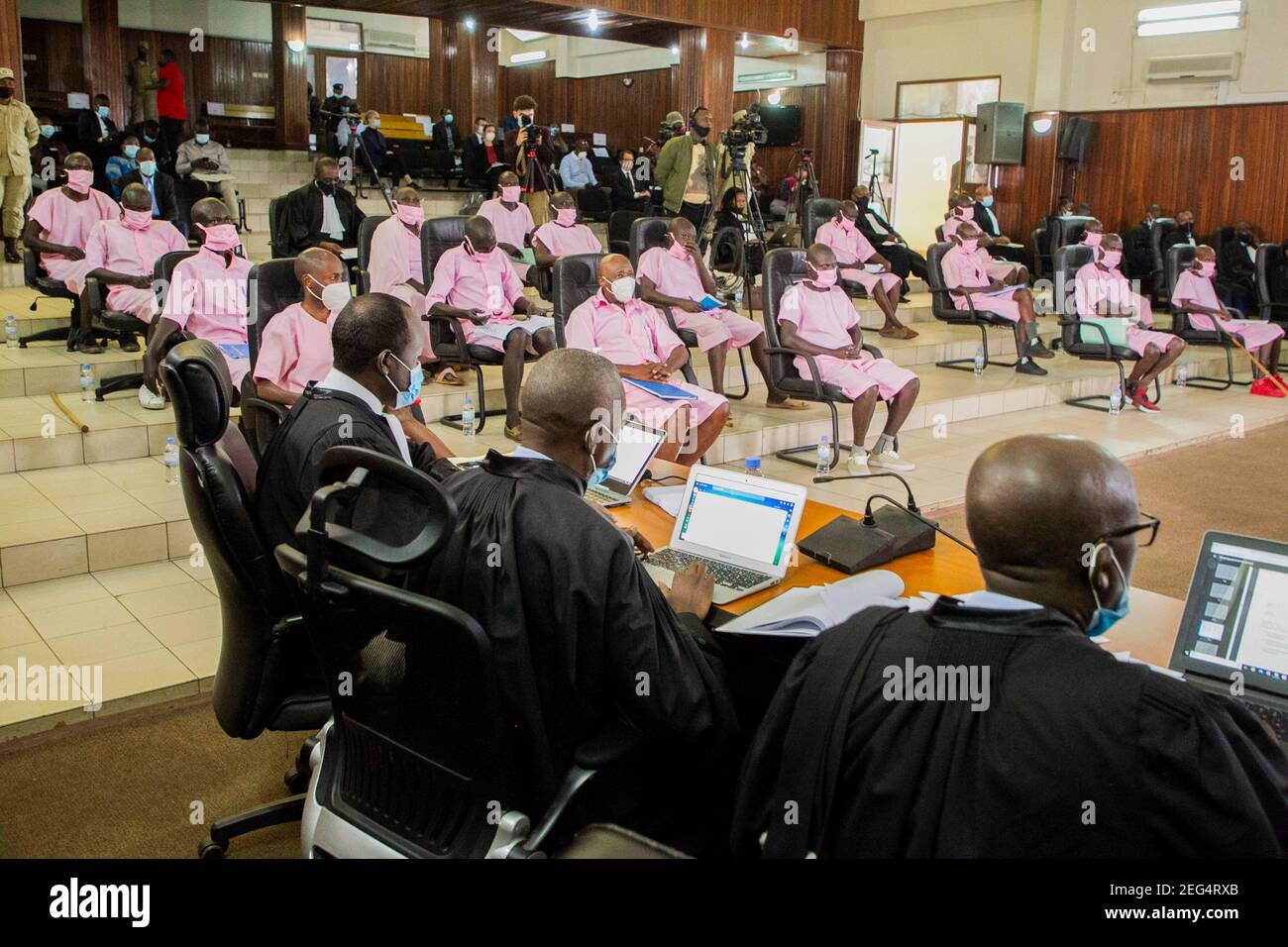 Kigali, Rwanda. 17th Feb, 2021. Paul Rusesabagina and other co-accused wait in a courtroom in Kigali, Rwanda, on Feb. 17, 2021. Rwanda's high court on Wednesday started trial against Paul Rusesabagina, portrayed as a humanitarian activist in the controversial Oscar-nominated film 'Hotel Rwanda,' for 13 charges including terrorism, financing terrorism and forming armed groups. Credit: Cyril Ndegeya/Xinhua/Alamy Live News Stock Photo