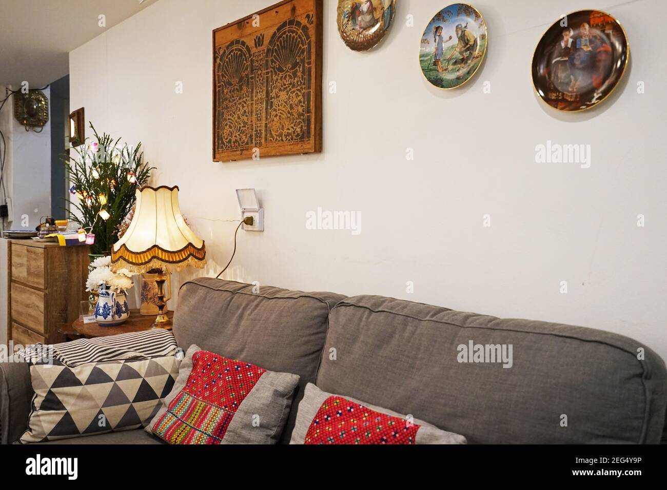 Interior design and decoration of local Thai cuisine restaurant decorated with wooden antique furniture and colorful hand painted ceramics Stock Photo