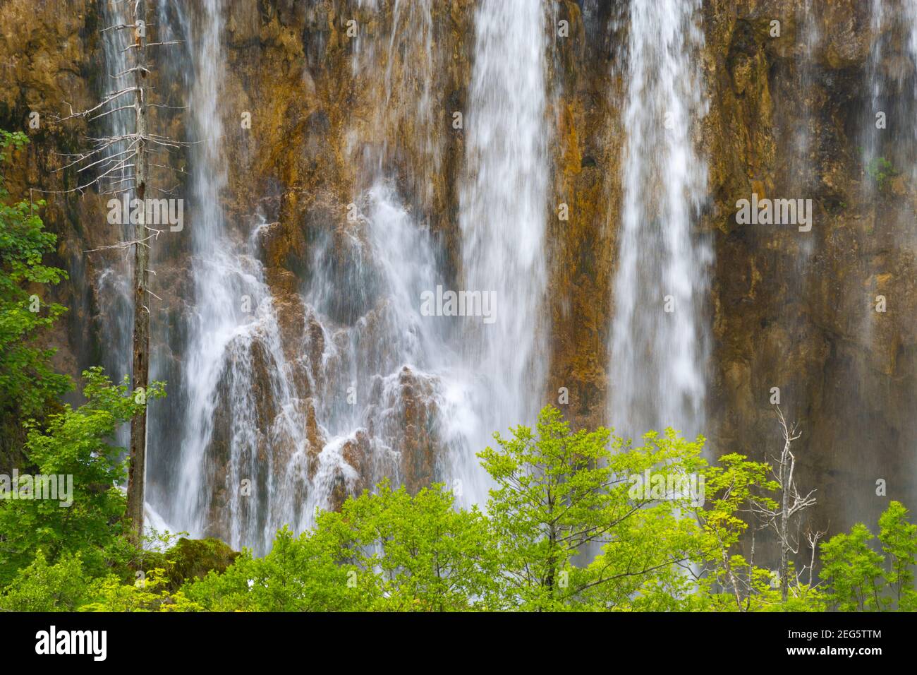 Waterfall streams streaming stream Spring season Green forest in Plitvice lakes Croatia Europe waterflow water flowing flow Stock Photo