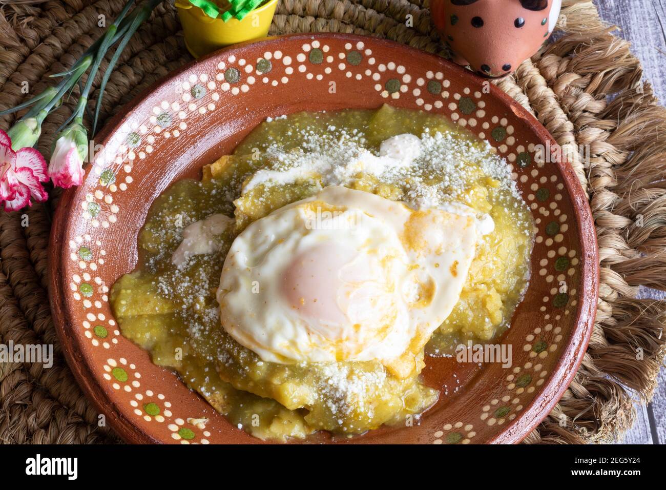 Mexican green chilaquiles with over medium egg Stock Photo Alamy