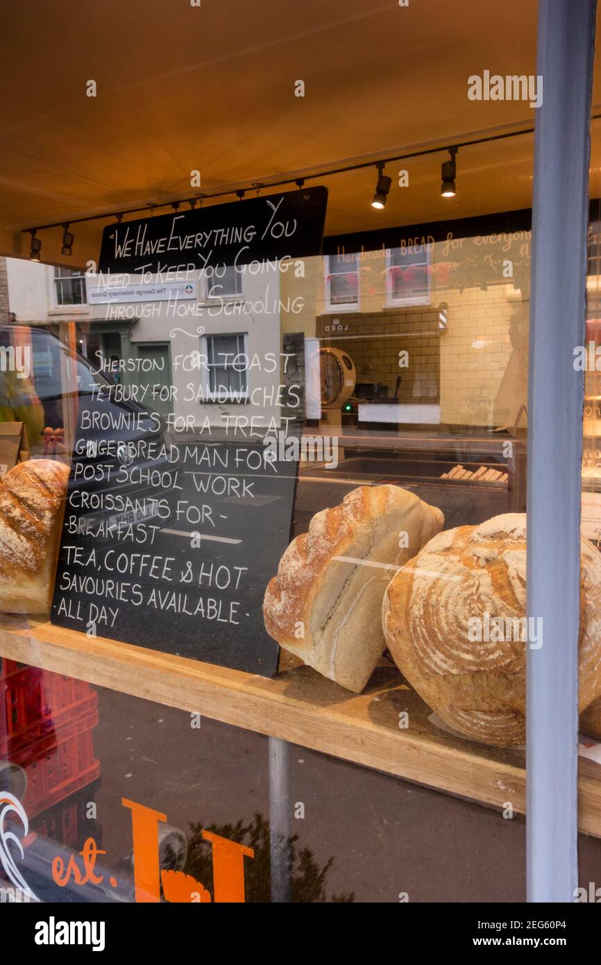 Window display of local artisan bakery shop, Tetbury, Gloucestershire, UK Stock Photo
