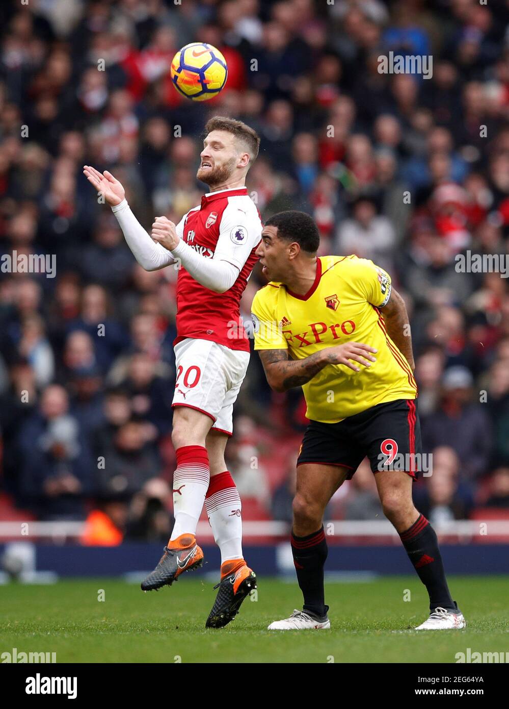 Soccer Football - Premier League - Arsenal vs Watford - Emirates Stadium, London, Britain - March 11, 2018   Arsenal's Shkodran Mustafi in action with Watford's Troy Deeney                REUTERS/Eddie Keogh    EDITORIAL USE ONLY. No use with unauthorized audio, video, data, fixture lists, club/league logos or 'live' services. Online in-match use limited to 75 images, no video emulation. No use in betting, games or single club/league/player publications.  Please contact your account representative for further details. Stock Photo