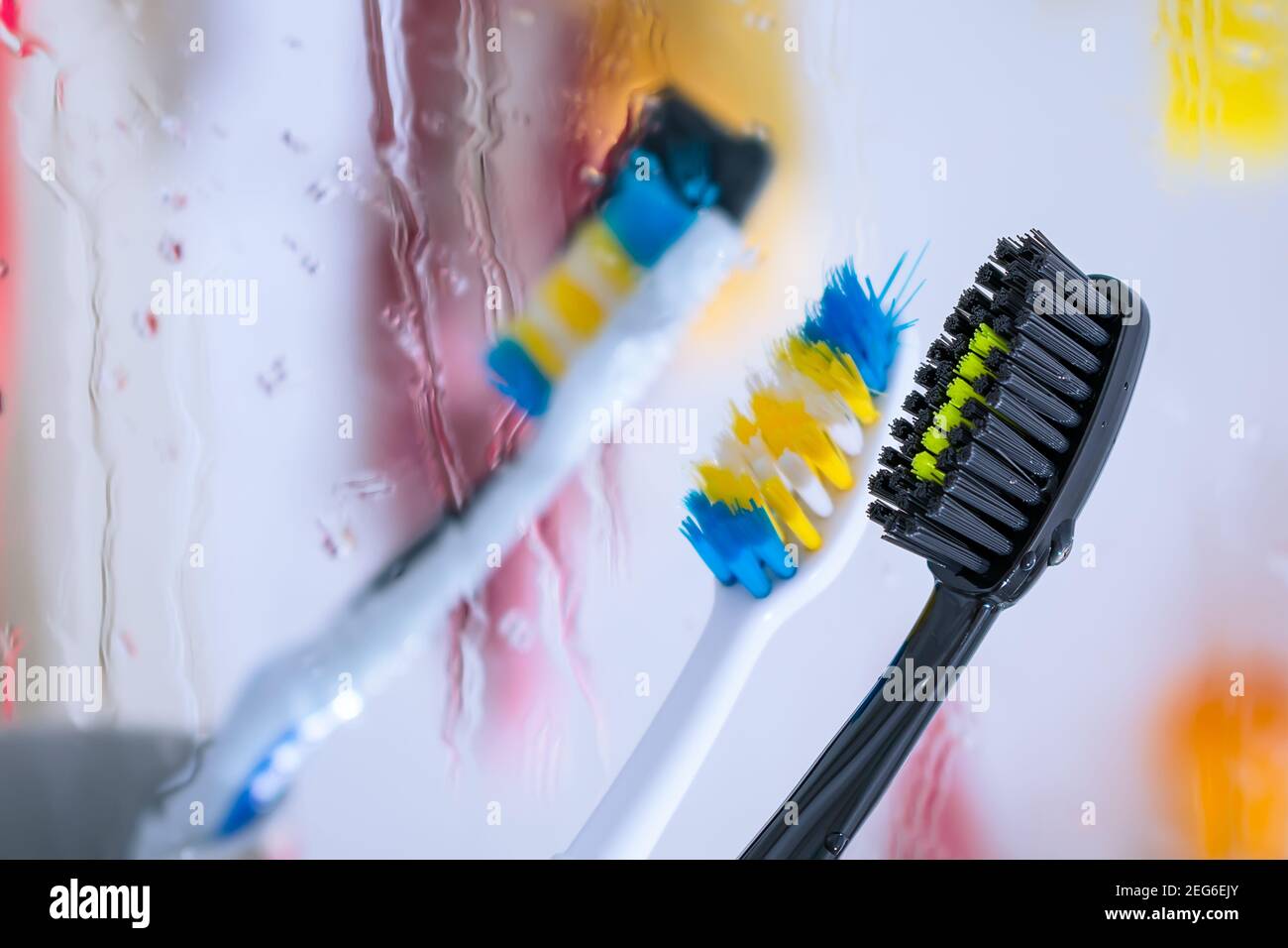Black toothbrush in the bathroom for brushing teeth and personal hygiene Stock Photo