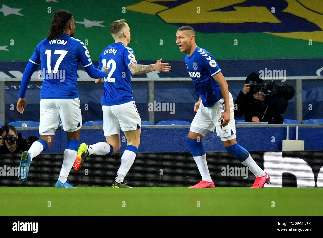Liverpool, United Kingdom, 17th February 2021. Pictured left to right, Everton’s Alex Iwobi and Everton’s Lucas Digne celebrate Everton's Richarlison scoring his side's first goal of the game. Credit: Anthony Devlin/Alamy Live News Stock Photo