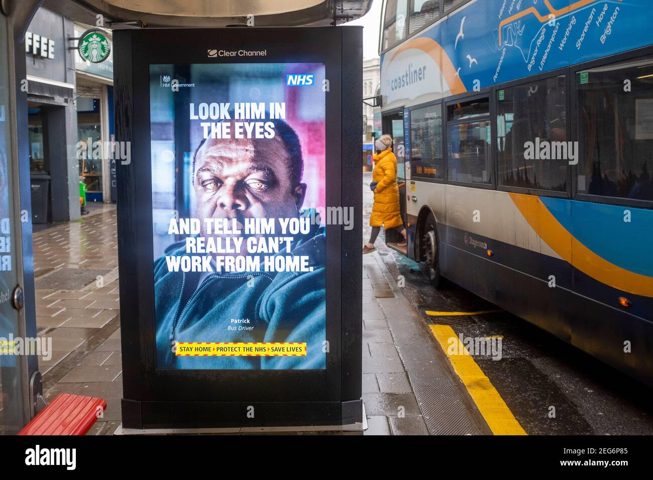 British Government NHS coronavirus COVID-19 Look Them in the Eyes health campaign poster at a bus stop in Brighton UK Stock Photo