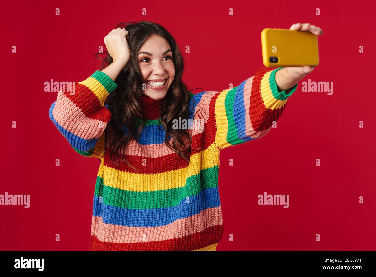 Happy beautiful girl taking selfie on cellphone and smiling isolated ...