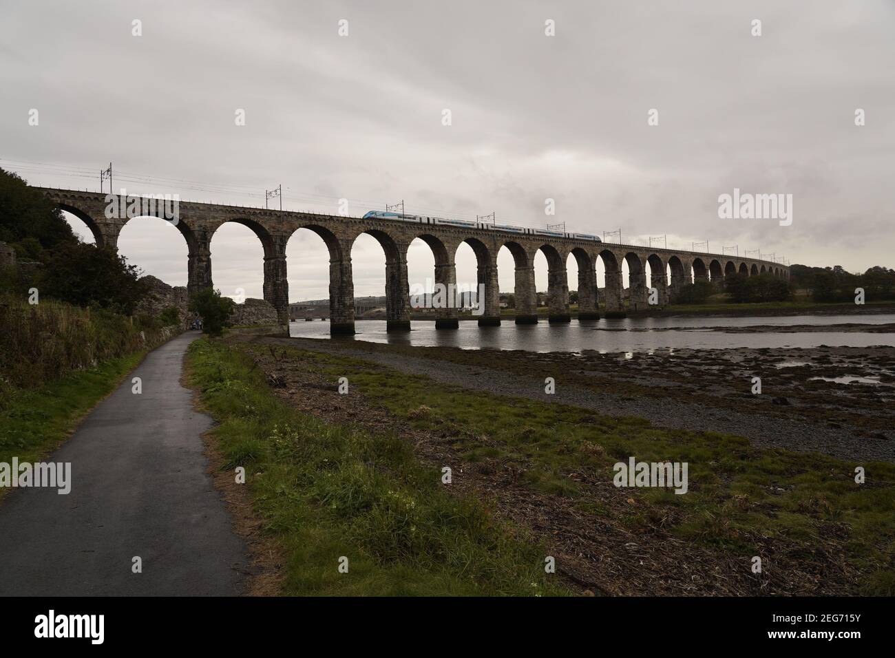 The Royal Border Bridge looping over the river Tweed with modern train zooming across. Stock Photo