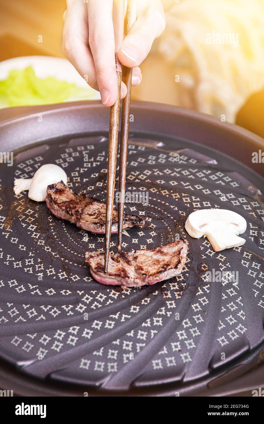 Yakiniku is the food that grilled a thin sliced beef and dipped in a