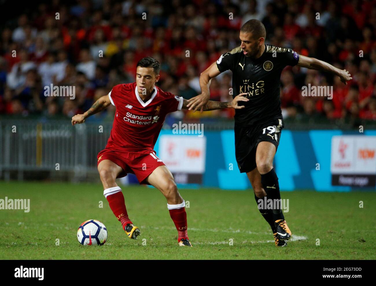 Soccer Football - Leicester City v Liverpool - Pre Season Friendly - The Premier League Asia Trophy - Final - June 22, 2017   Liverpool's Philippe Coutinho in action with Leicester City's Islam Slimani   REUTERS/BOBBY YIP Stock Photo
