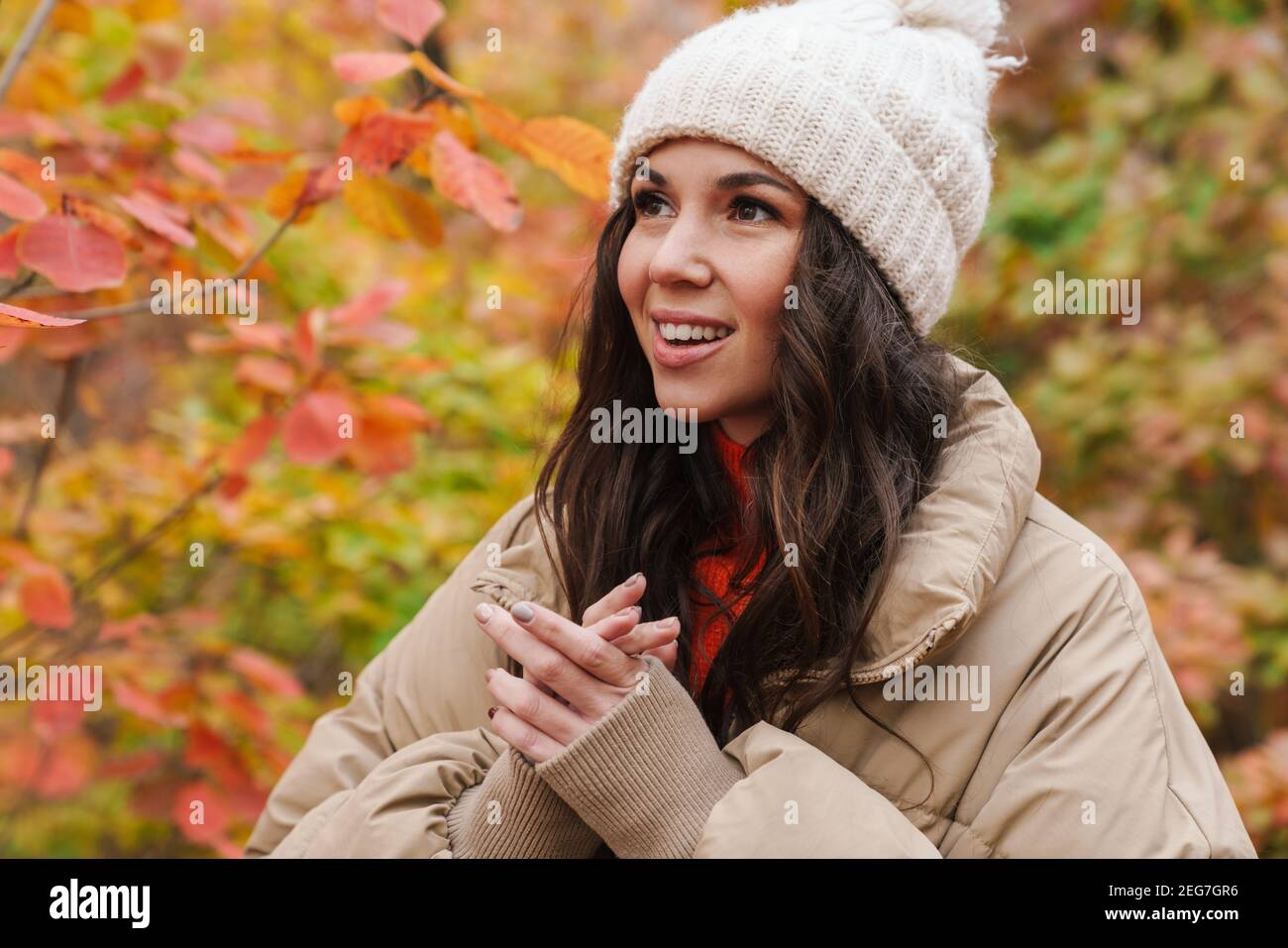 Lovely happy young woman walking in the autumn park Stock Photo - Alamy