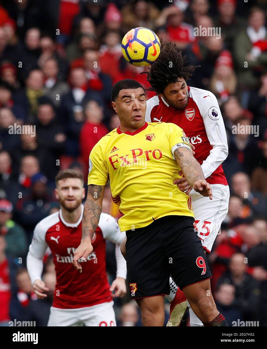 Soccer Football - Premier League - Arsenal vs Watford - Emirates Stadium, London, Britain - March 11, 2018   Watford's Troy Deeney in action with Arsenal's Mohamed Elneny       REUTERS/Eddie Keogh    EDITORIAL USE ONLY. No use with unauthorized audio, video, data, fixture lists, club/league logos or "live" services. Online in-match use limited to 75 images, no video emulation. No use in betting, games or single club/league/player publications.  Please contact your account representative for further details. Stock Photo