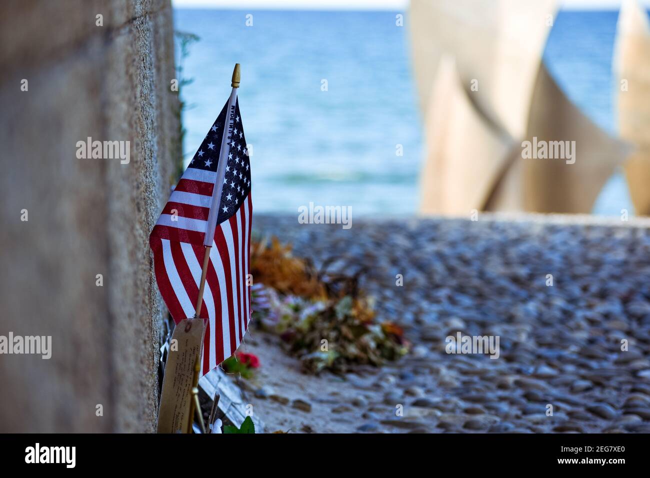 NORMANDY, FRANCE - July 4, 2017:detail of U.S. flag in the Monument to the Brave on the Historic beach called Omaha Beach in Vierville-sur-Mer, from t Stock Photo