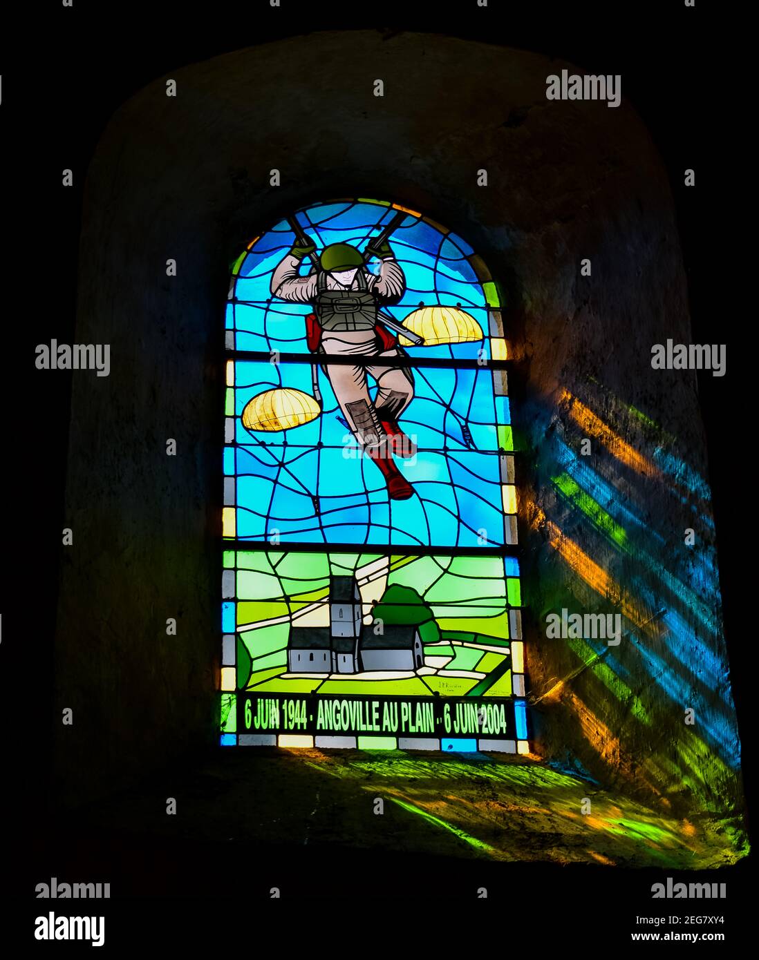 NORMANDY, FRANCE - July 4, 2017: Stained glass window in the Church Saint-Côme-et-Saint-Damien Angoville-au-Plain, with paratrooper from the battle of Stock Photo