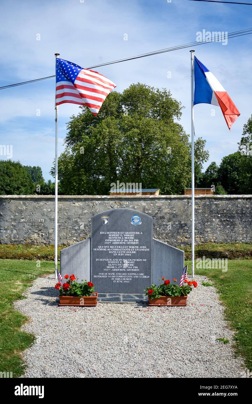 NORMANDY, FRANCE - July 4, 2017: Memorial to two doctors in Saint-Côme-et-Saint-Damien Angoville-au-Plain, from the battle of the Normandy landings du Stock Photo