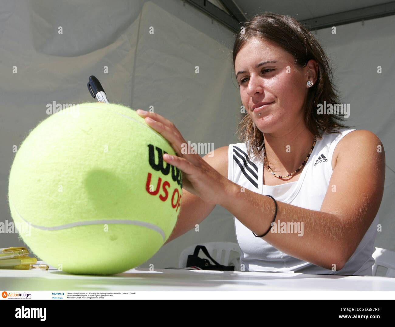 Tennis - Sony Ericsson WTA - Autograph Signing Session - Montreal, Canada - 15/8/06  Anabel Medina Garrigues of Spain signs a giant tennis ball   Mandatory Credit: Action Images / Chris Wattie Stock Photo