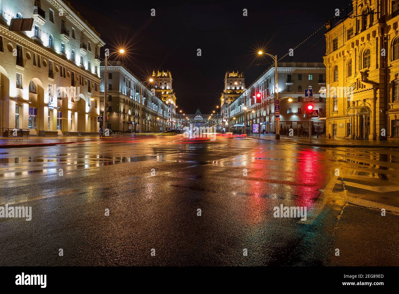 Gates of Minsk with the Main Train Station behind at a rainy night. Stock Photo
