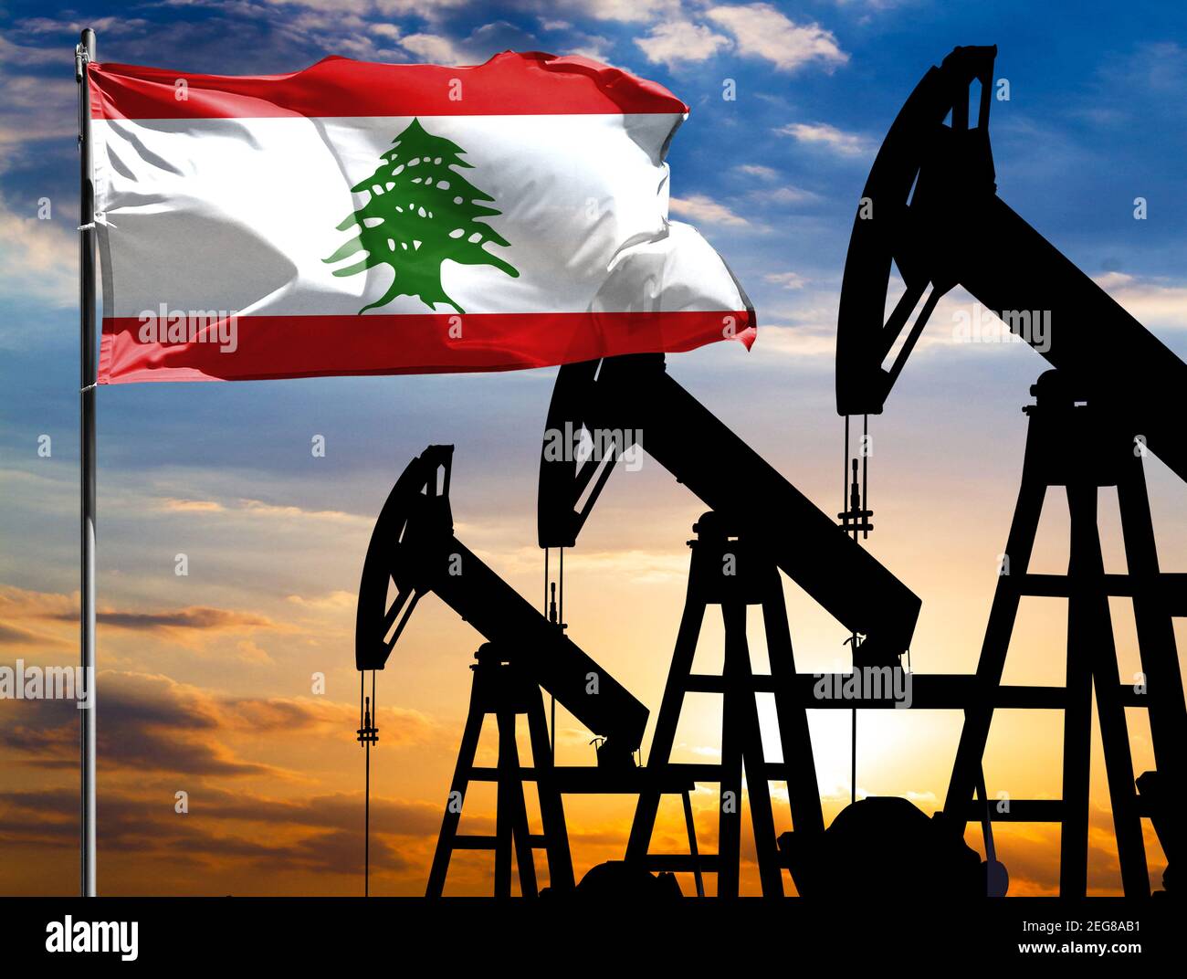 Oil rigs against the backdrop of the colorful sky and a flagpole with