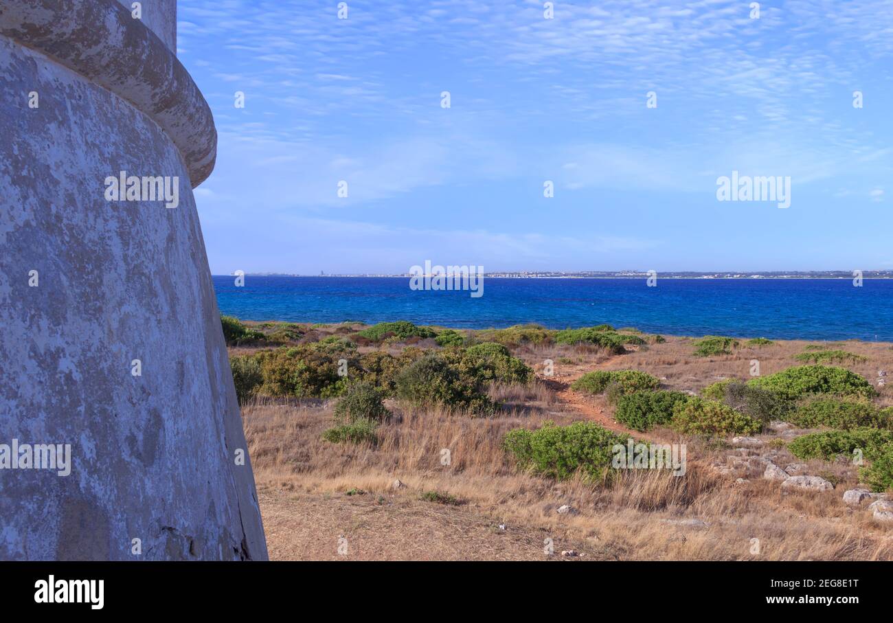 View of tower Punta Pizzo: the rocky coast  the sandy beach, Baia Verde stands out in the heart of Regional Nature Park  in Salento (Apulia, Italy). Stock Photo