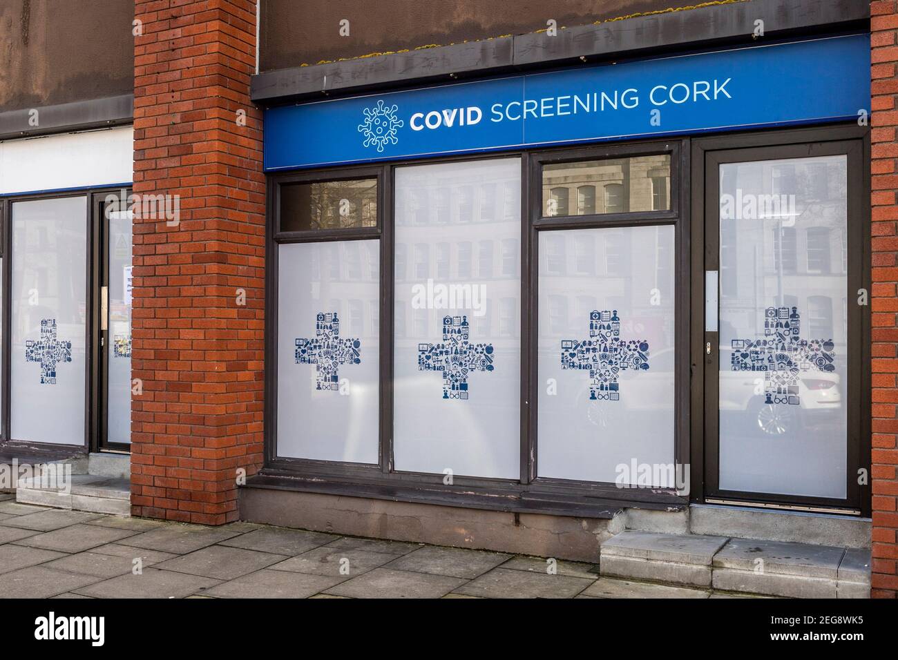 Cork, Ireland. 18th Feb, 2021. People in Cork city centre go about their business during the government's level 5 lockdown. This Covid Screening Centre was open and testing people. Credit: AG News/Alamy Live News Stock Photo