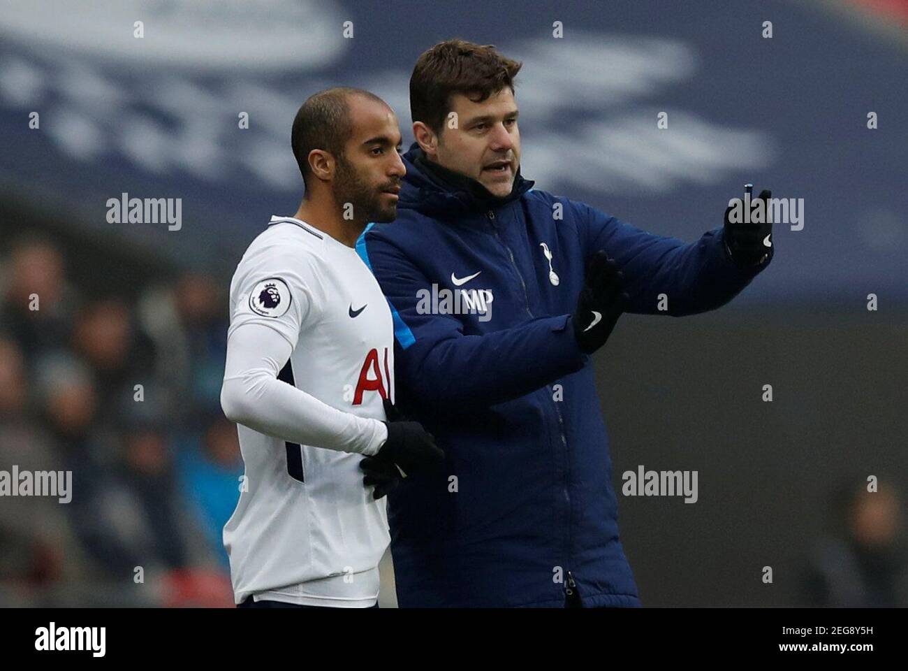 Soccer Football - Premier League - Tottenham Hotspur vs Huddersfield Town - Wembley Stadium, London, Britain - March 3, 2018   Tottenham's Lucas Moura with manager Mauricio Pochettino as he waits to be substituted   REUTERS/Eddie Keogh    EDITORIAL USE ONLY. No use with unauthorized audio, video, data, fixture lists, club/league logos or 'live' services. Online in-match use limited to 75 images, no video emulation. No use in betting, games or single club/league/player publications.  Please contact your account representative for further details. Stock Photo