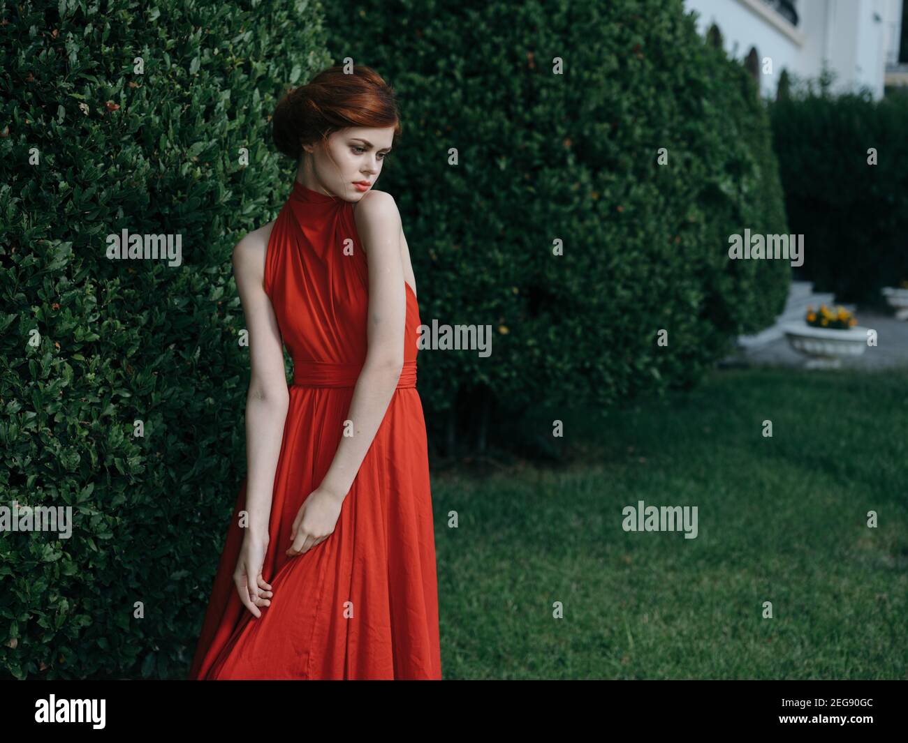 Pretty woman red dress Masquerade walk gothic style Stock Photo Alamy