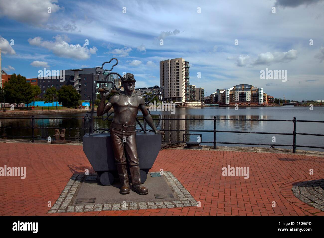 Bronze statue of Coalminer, from pit to port, Roath Basin, Cardiff Bay, Wales, UK Stock Photo