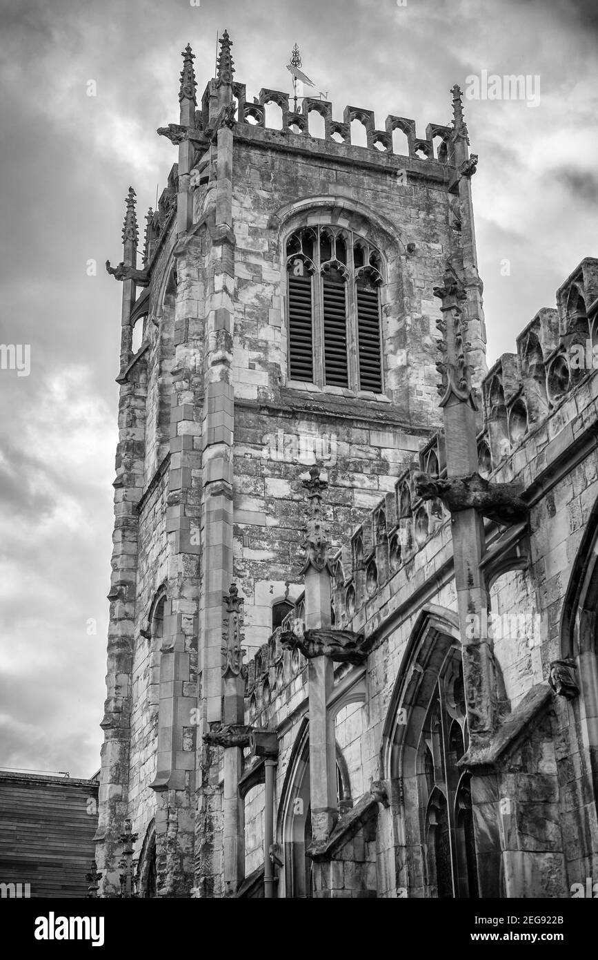 St Martin Le Grand church in York.  The tower stretches up to a cloudy sky. Stock Photo