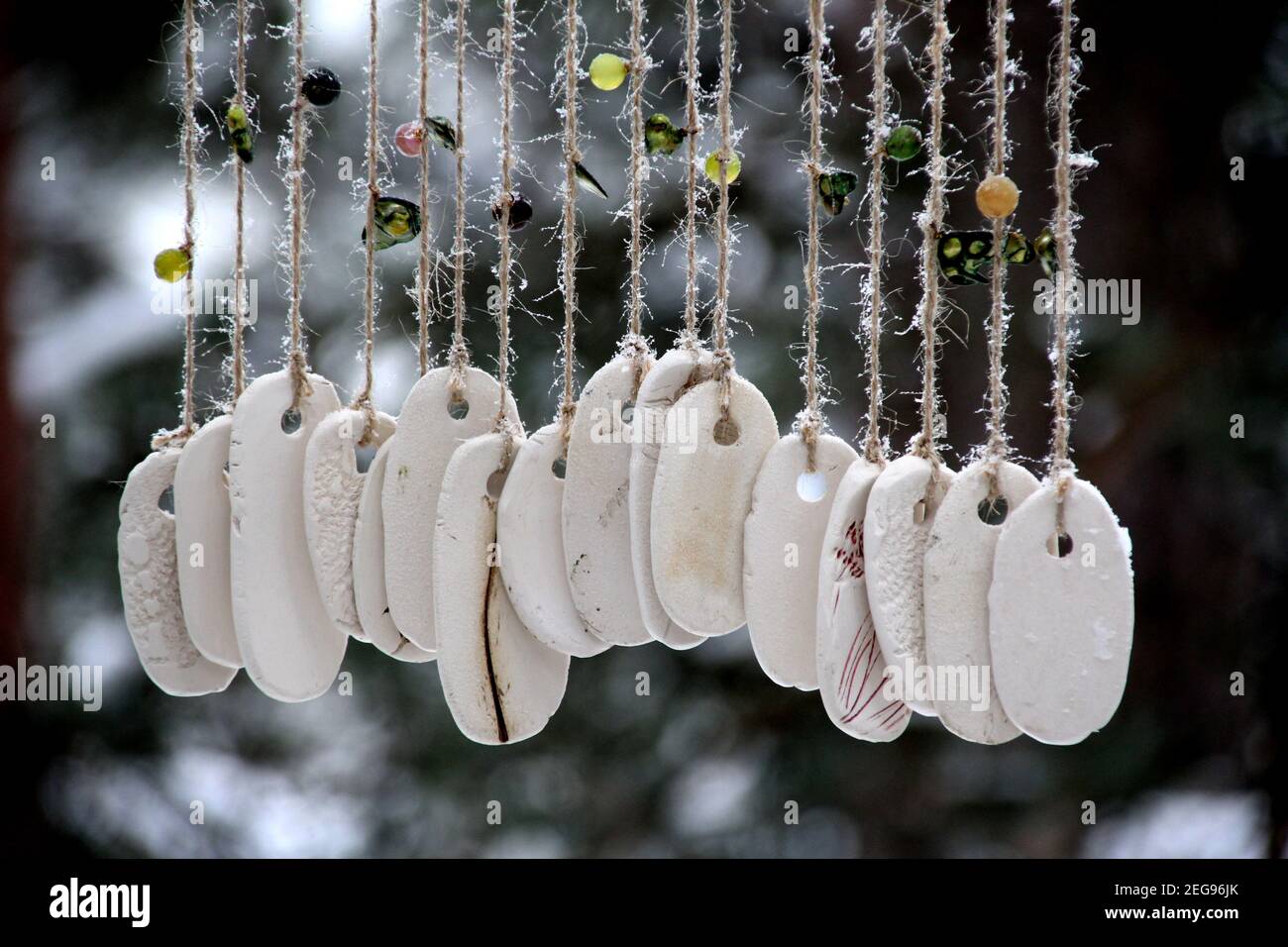 Hand made wind chimes hanging on a string with depth of field effect