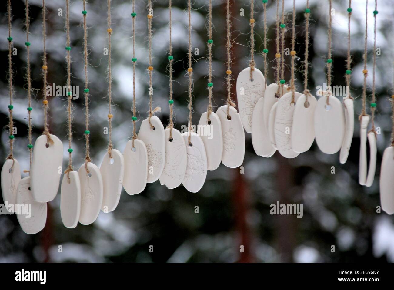 Hand made wind chimes hanging on a string with depth of field effect