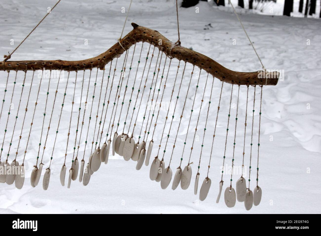 Hand made wind chimes hanging on a string with depth of field effect