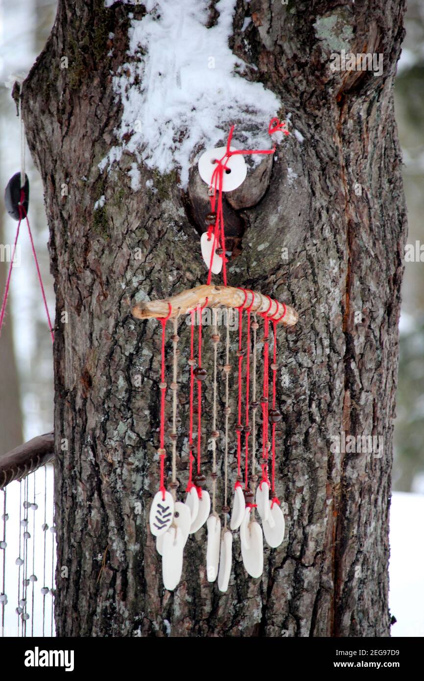 Hand made wind chimes hanging on a string with depth of field effect