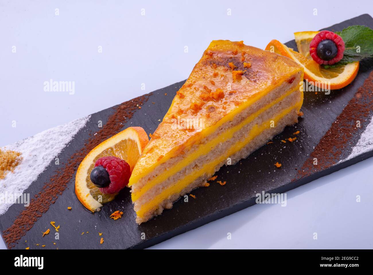 Orange cake with dried fruit liqueur Stock Photo Alamy