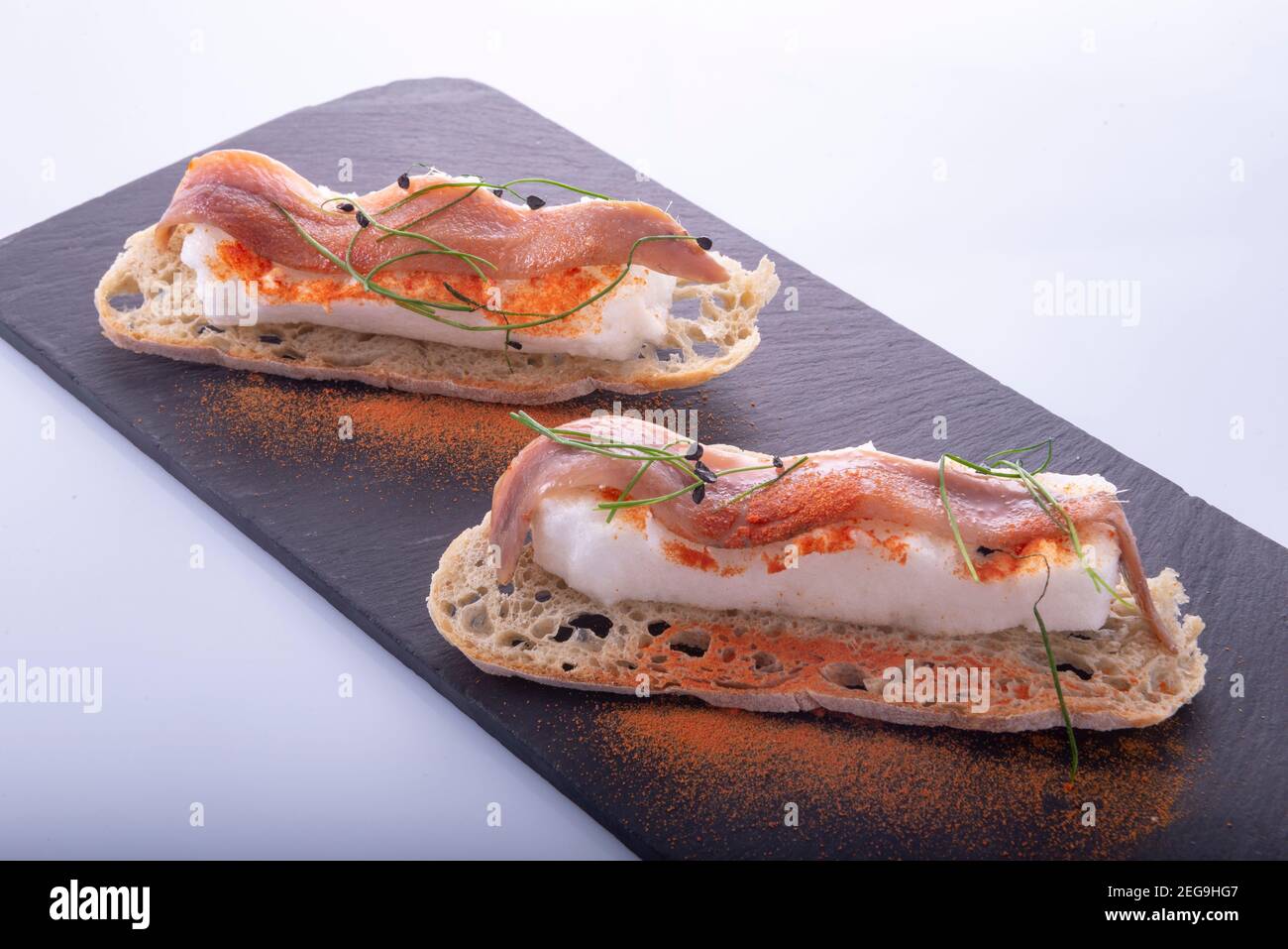 Cantabrian anchovies on crusty bread toast Stock Photo Alamy