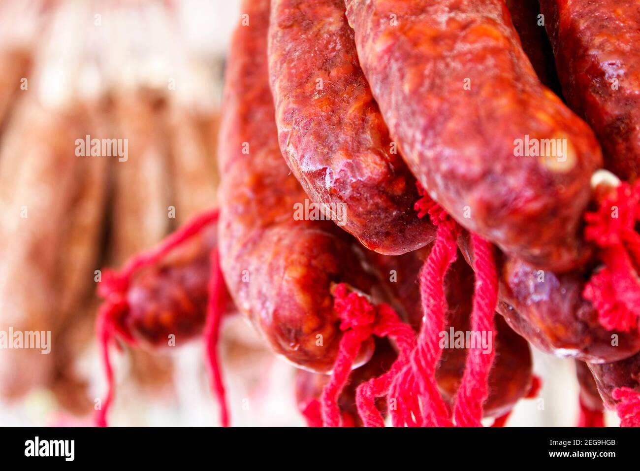 Spicy pork sausage for sale at a market stall in Spain Stock Photo