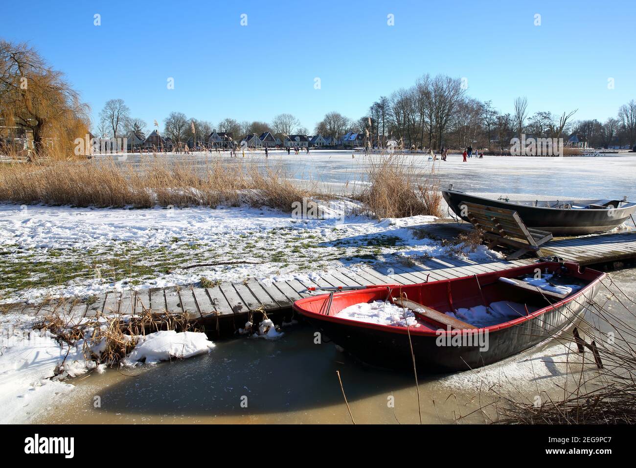 Winter snow and people ice skating on frozen water in Broek in Waterland, a  small town with old and painted wooden houses, North Holland,Netherlands  Stock Photo - Alamy