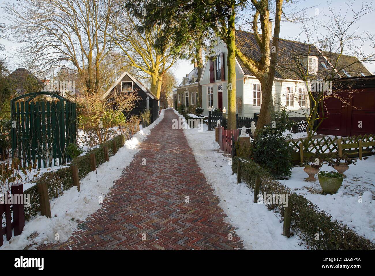 Winter snow in Broek in Waterland, a small town with traditional old and painted wooden houses, North Holland, Netherlands. Stock Photo
