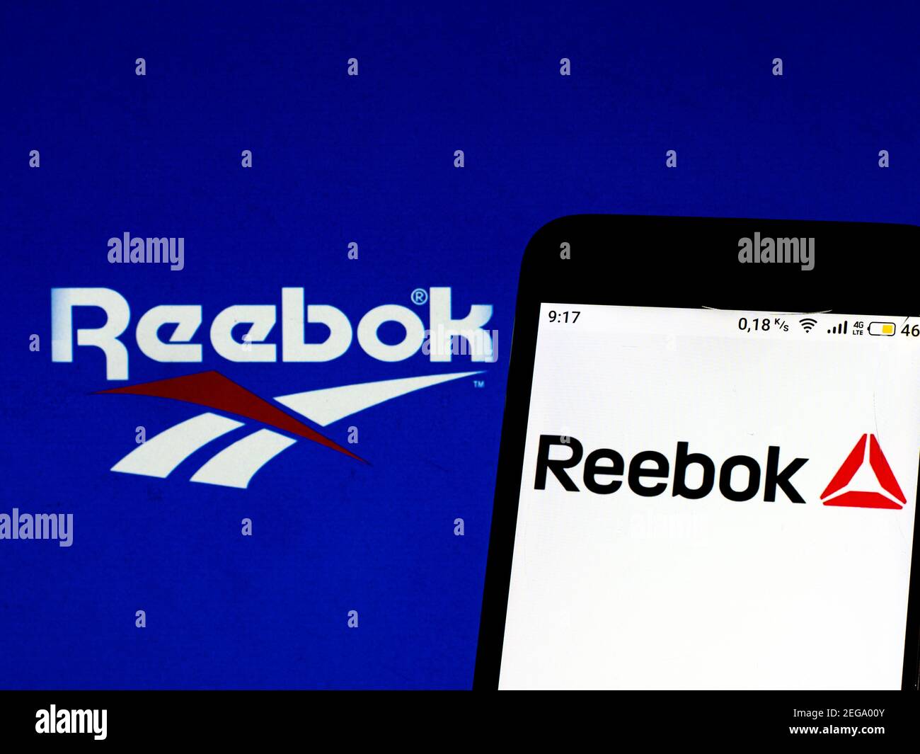 In this photo illustration a Reebok logo seen displayed on a smartphone  screen with a computer keyword in the background in Athens, Greece on  December 18, 2021. (Photo by Nikolas Kokovlis/NurPhoto Stock Photo - Alamy, image size:1300x1065