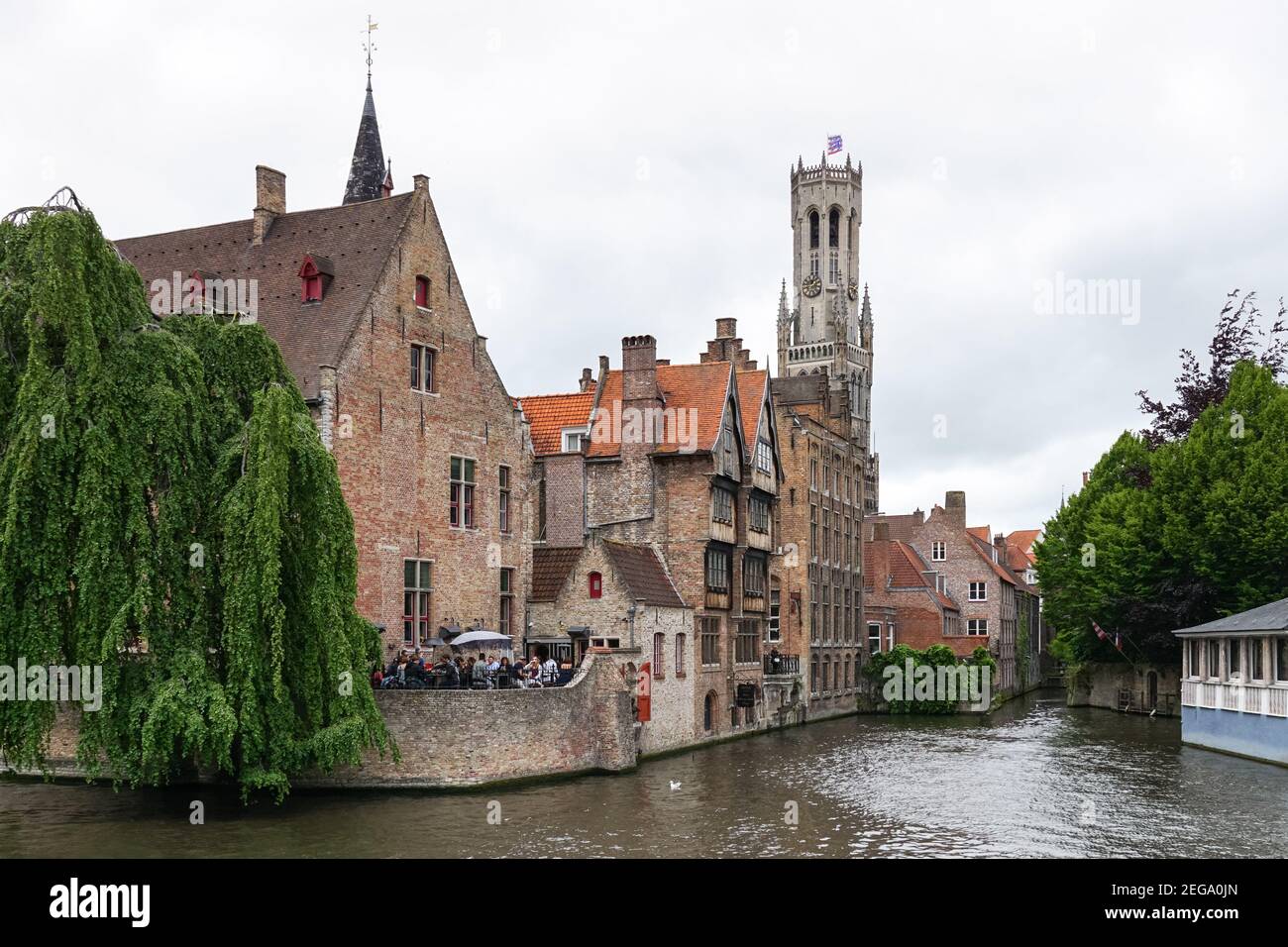 Medieval buildings on the Dijver canal with the Belfry bell tower seen from Rozenhoedkaai in Bruges, Belgium Stock Photo