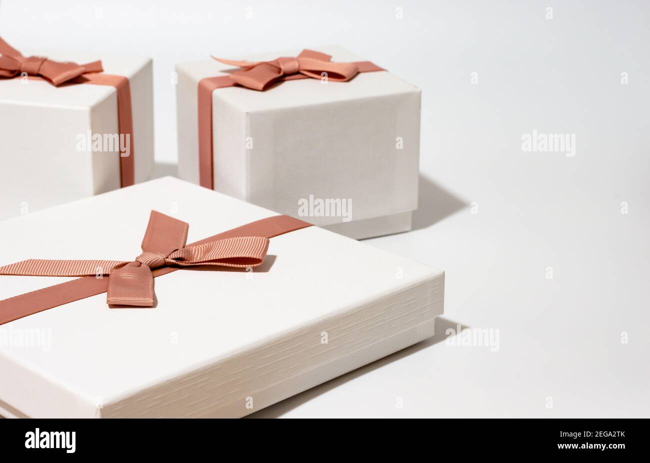 three white gift boxes on empty white background Stock Photo