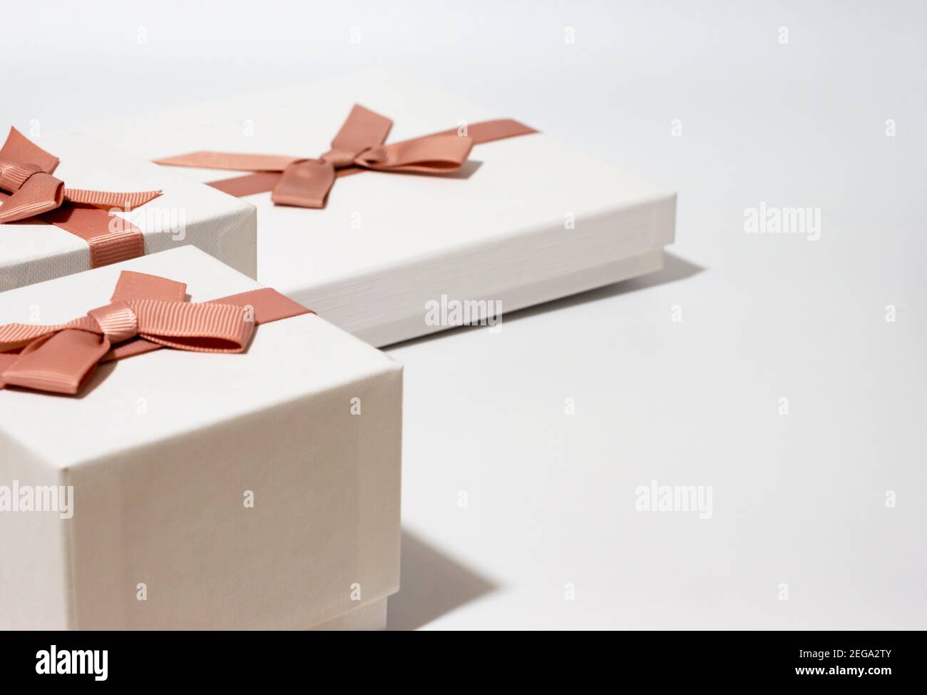 three white gift boxes on empty white background Stock Photo