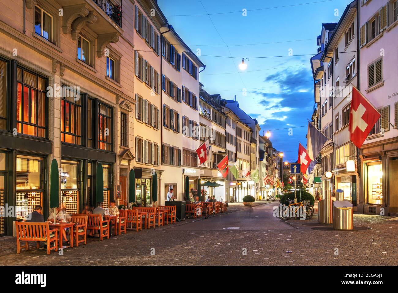 Evening scene along the historic medieval street of Rennweg, today part of the inner-city pedestrian zone of Zürich, Switzerland. Stock Photo