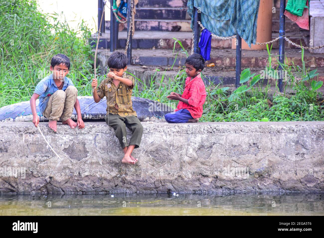 Indian boys playing, Kerala Backwaters, Kerala, India Stock Photo