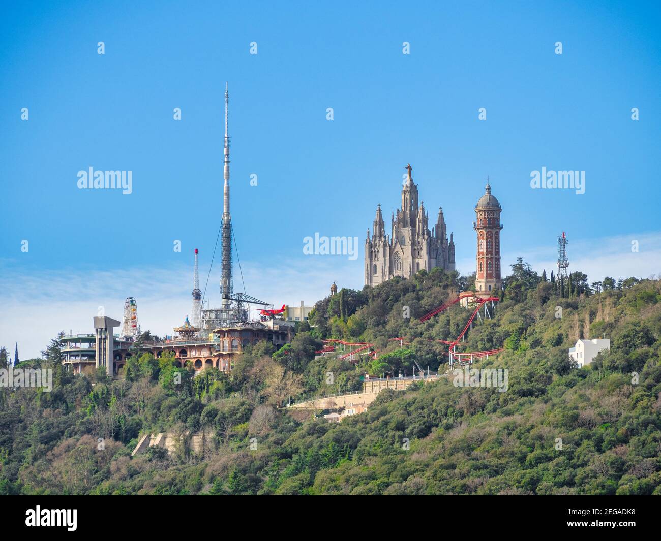 The summit of Mount Tibidabo, the highest point in the city of Barcelona, Spain. Visible are the Cathedral of the Sacred Heart, the Amusement Park, an Stock Photo