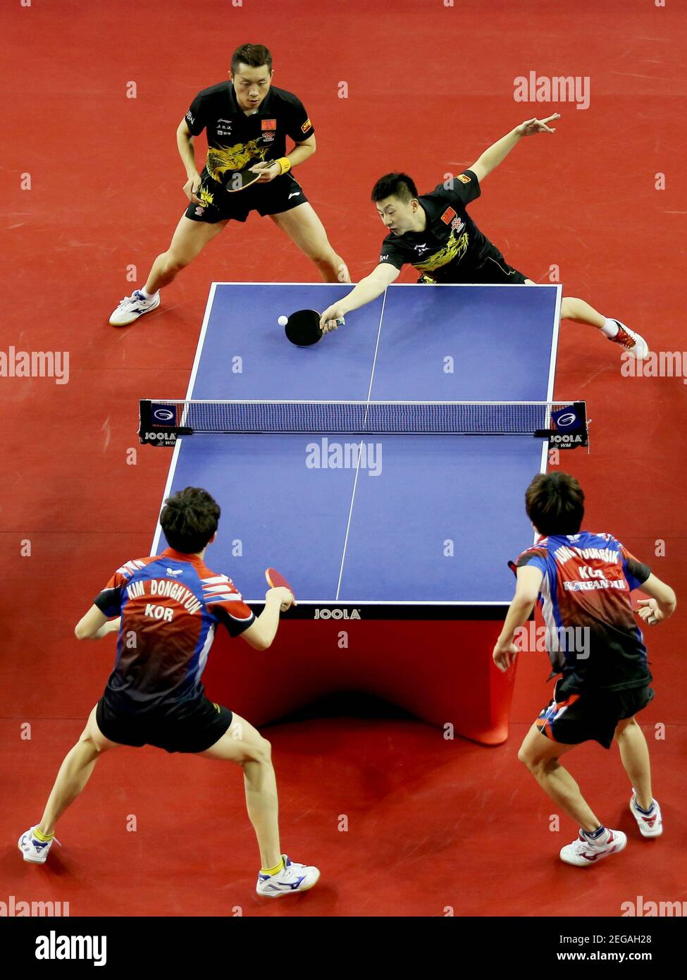 Table Tennis - ITTF - Qatar Open - Qatar - 21/2/14 Men's Doubles - Ma Long  and Xu Xin of China in action with Jung Youngsik and Kim Donghyun of South  Korea