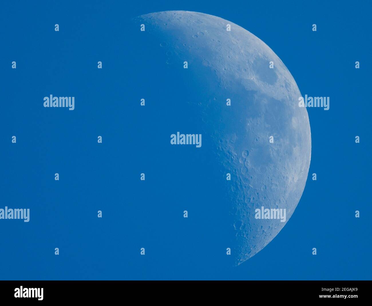 18 February 2021, London, UK. Waxing Crescent Moon in blue sky. Credit: Malcolm Park/Alamy Stock Photo