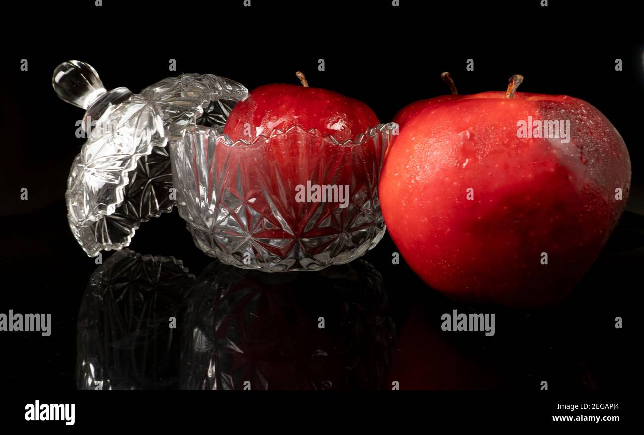 Red apples with water drops, isolated on black background Stock Photo