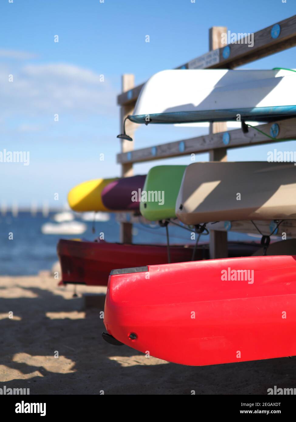 Image of kayaks stored on the beach Stock Photo - Alamy