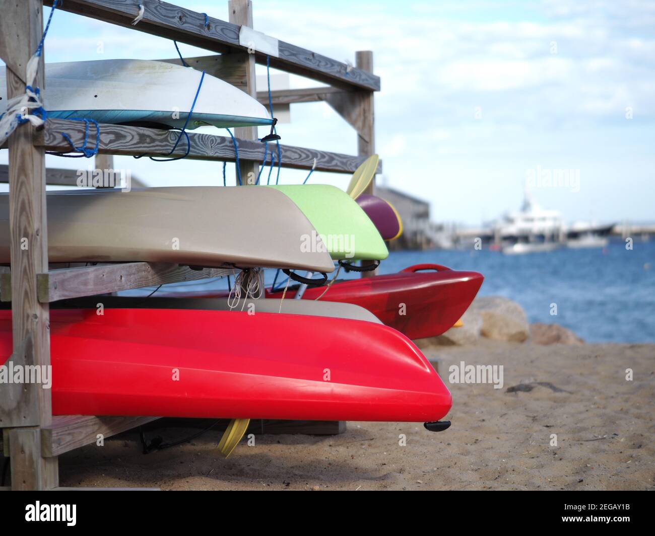 Image of kayaks stored on the beach Stock Photo - Alamy