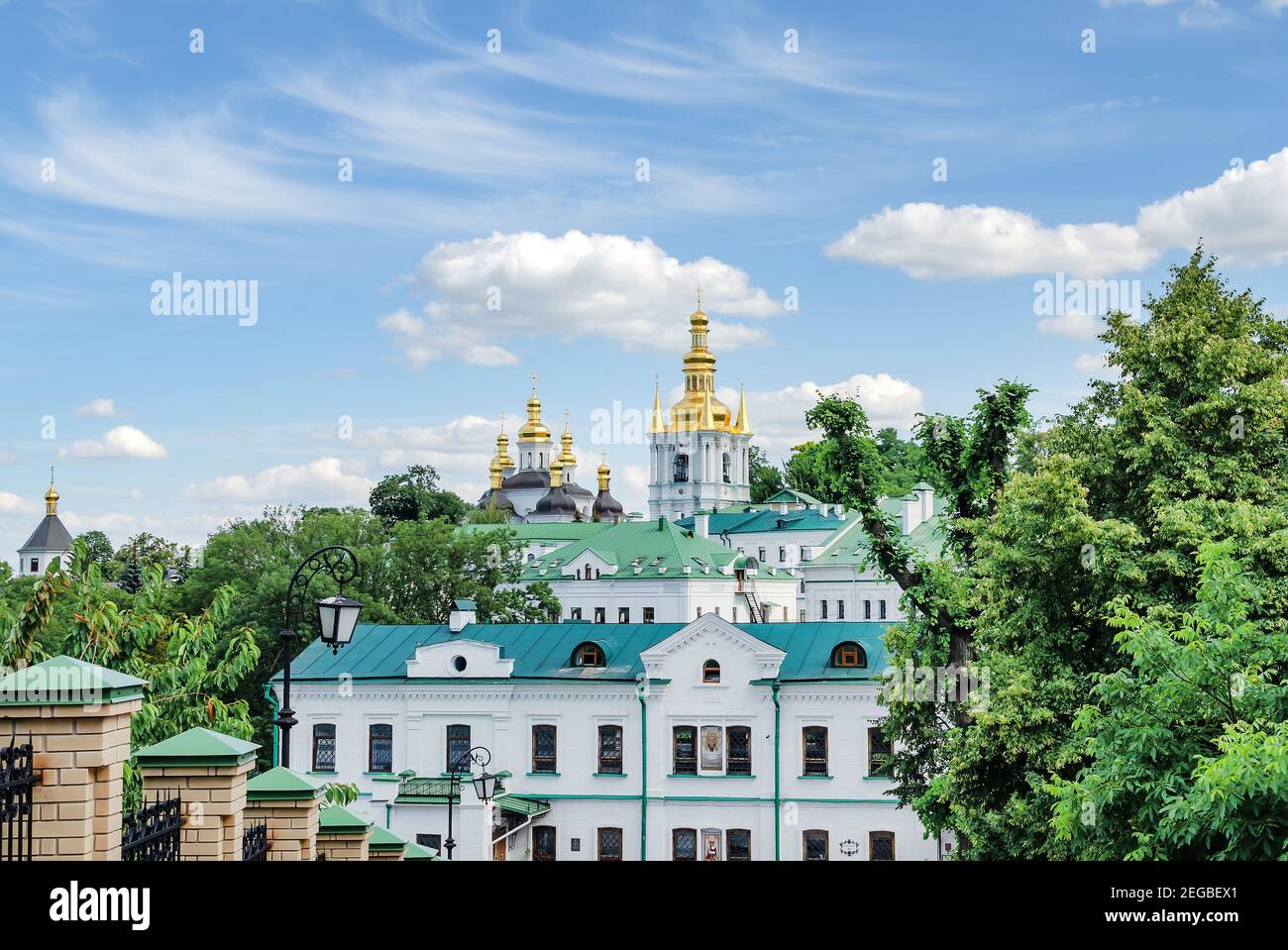 golden domes and a cross of the Orthodox Church against the blue sky, on a warm summer day Ukraine, Kiev Stock Photo