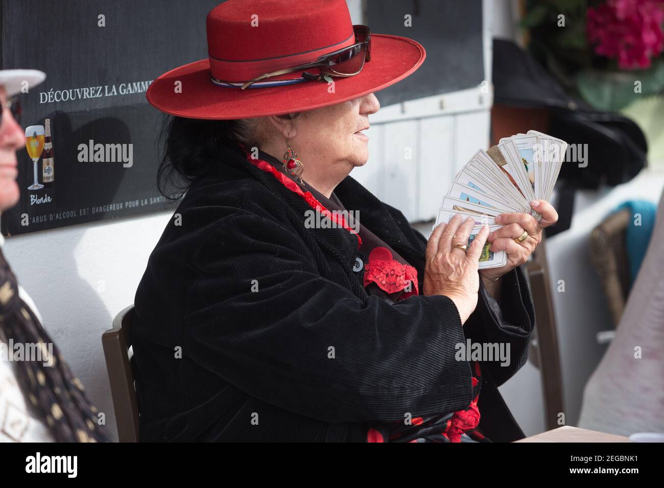 Woman holding Tarot Cards Stock Photo